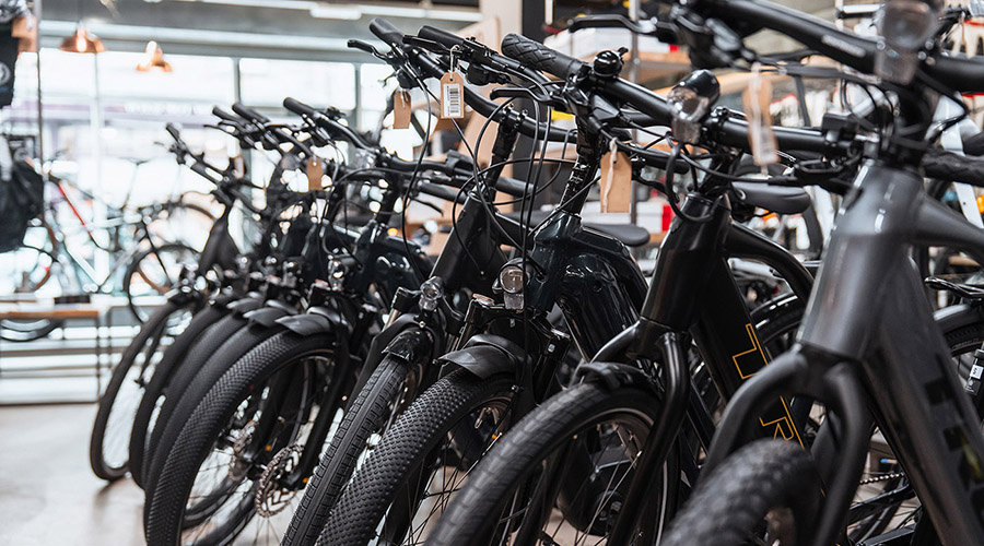 row of Trek hybrid bikes on display in a bike shop in Lancaster, Lancashire